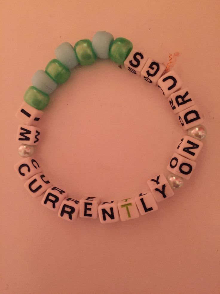 a beaded bracelet with words written on it