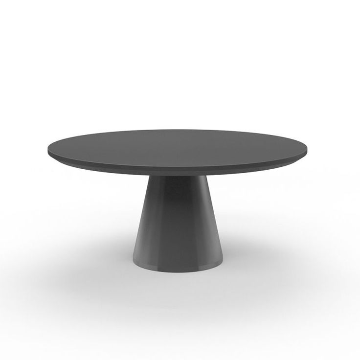 a black round table sitting on top of a white floor