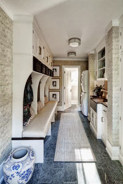 a long narrow hallway with blue and white decor