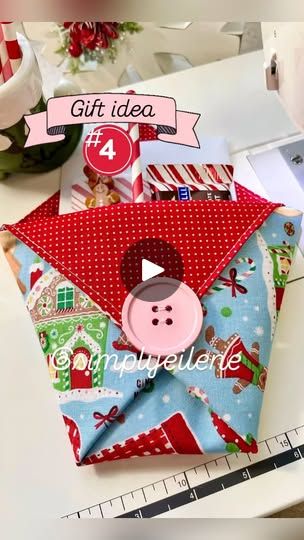 an origami envelope with a button on it