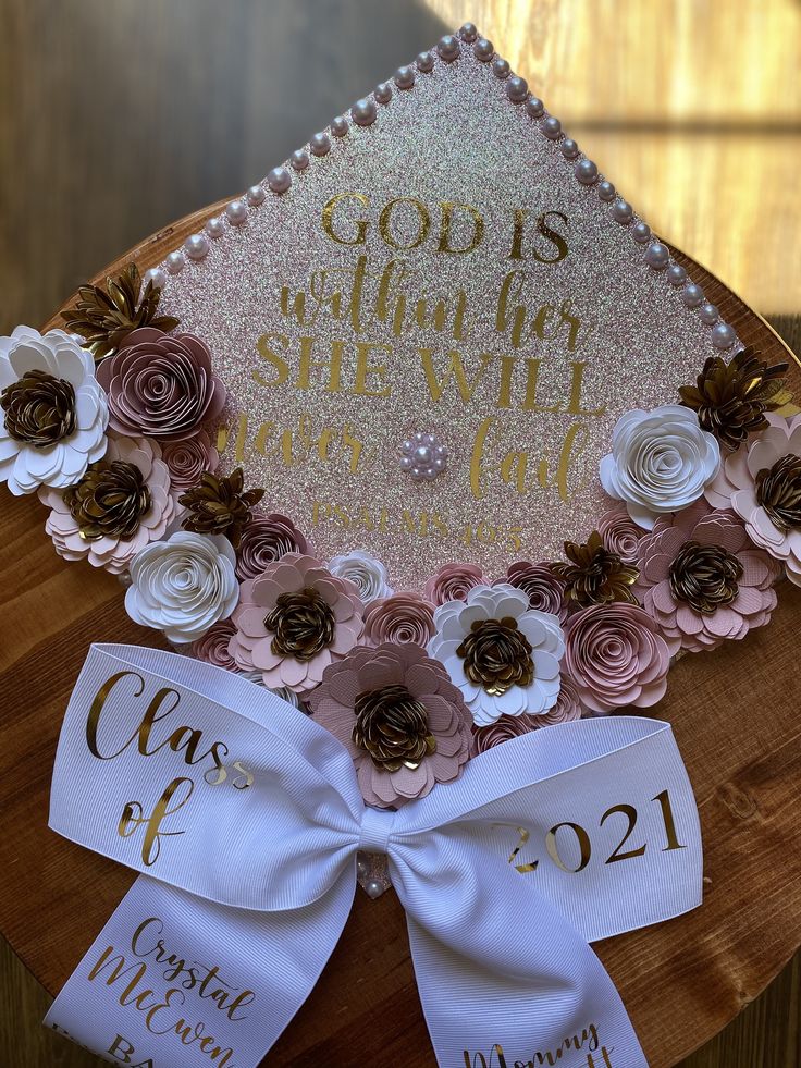 a graduation cap decorated with flowers and ribbons