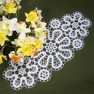 two crochet doily designs with daffodils and daffodils in the background