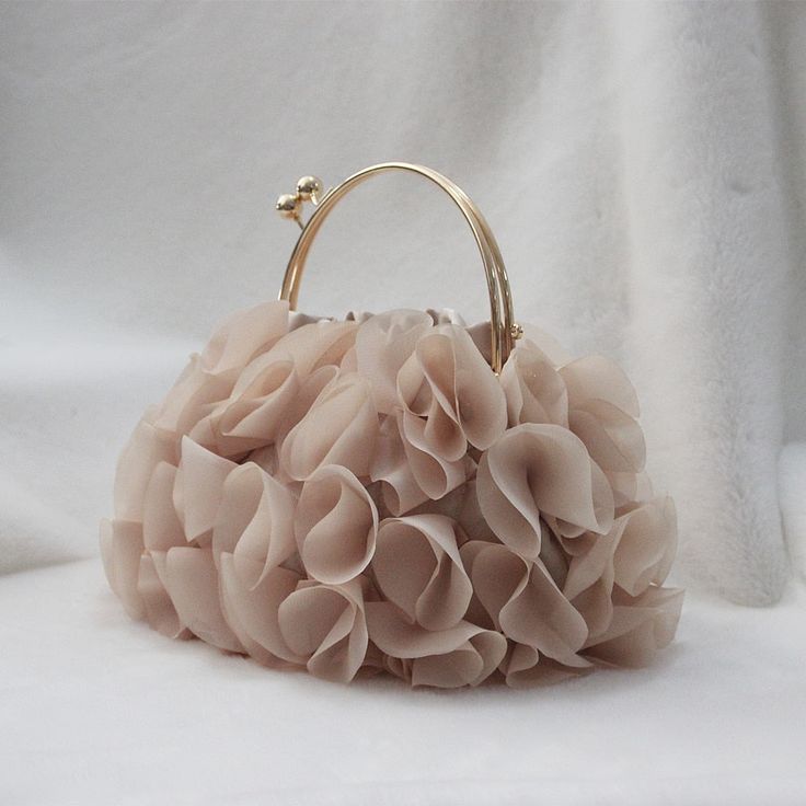 Handbags Type: TotesTypes of bags: Top-Handle BagsMain Material: PolyesterShape: FrameExterior: NONEGender: WOMENStyle: FashionClosure Type: HaspInterior: Interior Slot PocketHardness: SOFTPattern Type: SolidLining Material: PolyesterDecoration: FlowersDecoration: SequinedDecoration: DiamondsOccasion: VersatileItem Type: HandbagsColor: ChampagneMaterial: PolyesterOccasion: Wedding,Party,Casual,Formal Simpul Pita, Fancy Purses, Tas Fashion, Floral Clutches, Bridal Bag, Wedding Purse, Wedding Clutch, Potli Bags, Girly Bags