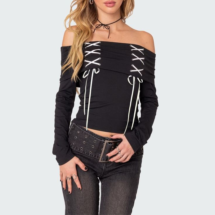 Elevate your style effortlessly with our Black Gothic Off-The-Shoulder Long Sleeve Top. The lace-up detail and folded neckline bring an edgy touch, while the bardot top style exudes sophistication. Crafted from a comfortable and stylish blend of polyester and spandex, this top is a must-have for your wardrobe. Lace-up detail Folded neckline Long sleeves Bardot top style Comfortable blend of polyester & spandex Bardot Top, Style Comfortable, Off The Shoulder Long Sleeve, Long Sleeve Top, Polyester Spandex, Elevate Your Style, Off The Shoulder, Top Styles, Long Sleeve Tops