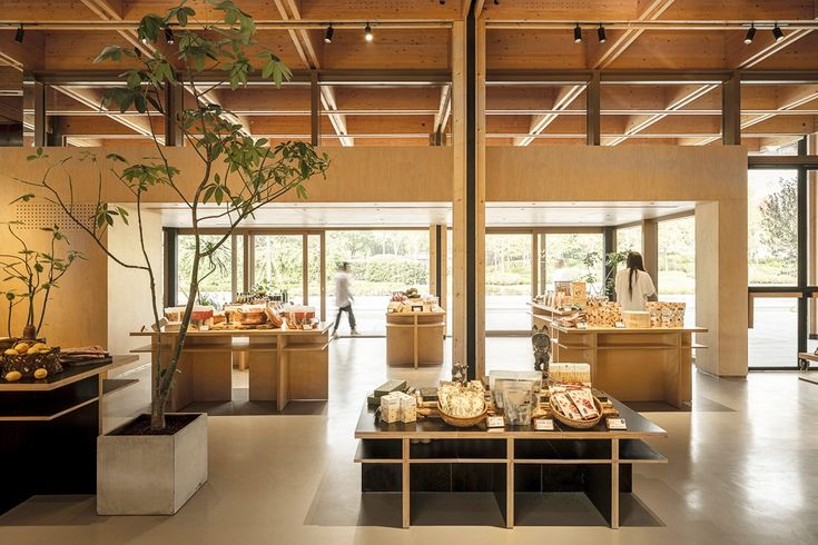 the interior of a restaurant with food on display