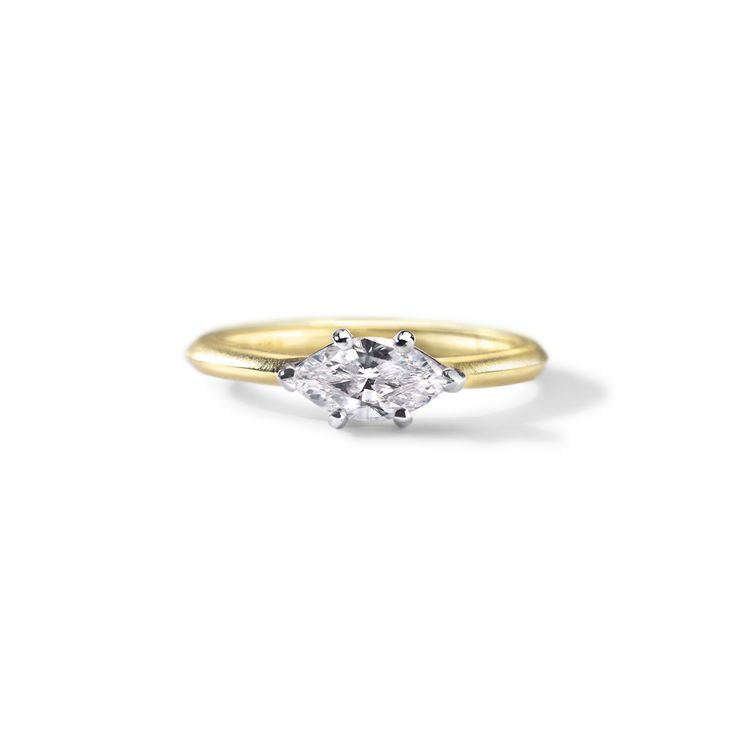 The New Moon Marquise Engagement ring is set with two tone complementary precous metals. The basket is hand made from Platinum and the ring from your choice of gold color or platinum. The marquise is set east-west with a conflict-free marquise diamond. The ring is handcrafted using sustainable techniques and recycled gold. Dimensions: Pictured in a 1.0ct diamond; Band Width 2.1mmDelivery: This item is made to order. Please allow up to 3-4 weeks for delivery. Moon Engagement Ring, Marquise Engagement Ring, Engagement Rings Marquise, Marquise Diamond, Recycled Gold, East West, Diamond Band, New Moon, Brilliant Diamond