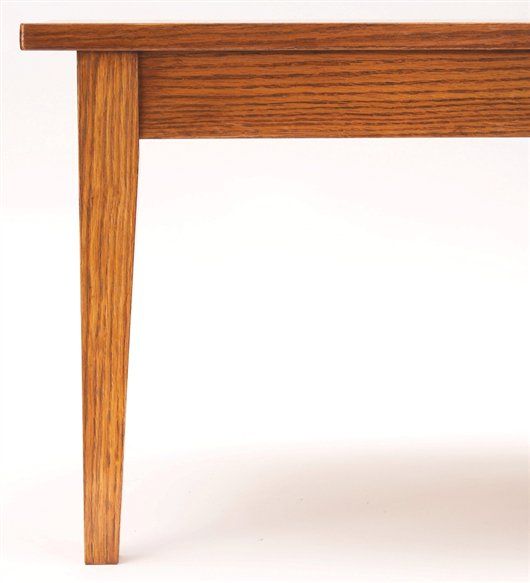 a wooden table with two legs and a white surface in the center, against a white background