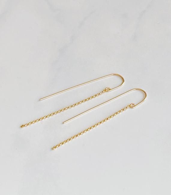 These simple modern threaders are lightweight and make great everyday earrings.  The threader is hand forged from 14kt gold filled wire into a curved U shape. 14kt gold filled rolo chain dangles from the front of the threader.  The drop length of the chain is 2 1/2” Delicate Chain Threader Earrings For Everyday, Delicate Threader Earrings With Chain For Everyday, Delicate Everyday Threader Earrings With Chain, 14k Gold Filled Threader Earrings For Everyday, Everyday 14k Gold Filled Long Drop Earrings, Everyday Long Drop Threader Earrings With Adjustable Chain, Delicate Long Drop Threader Earrings With Chain, Simple Gold Threader Earrings, Delicate 14k Gold Filled Threader Earrings