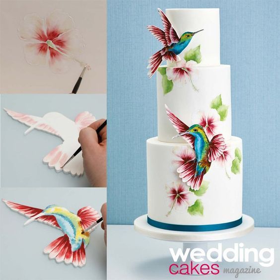 the wedding cake is decorated with flowers and birds