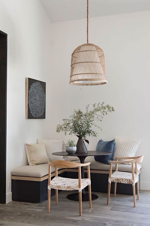 a living room with two chairs and a table