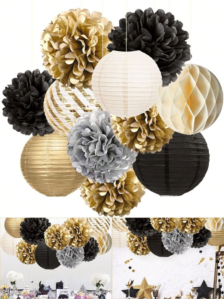 black, gold and white paper flowers are hanging from the ceiling in this party setting