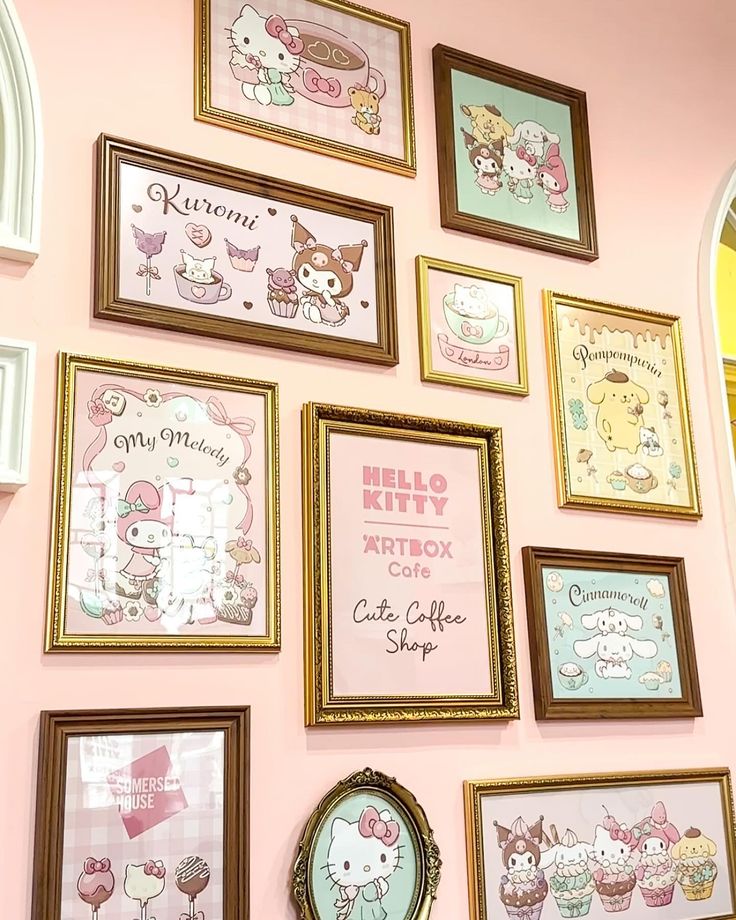 there are many pictures on the wall with hello kitty characters in them, including cats and cupcakes