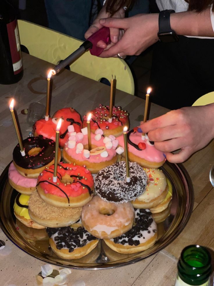 there are many donuts that have candles on them