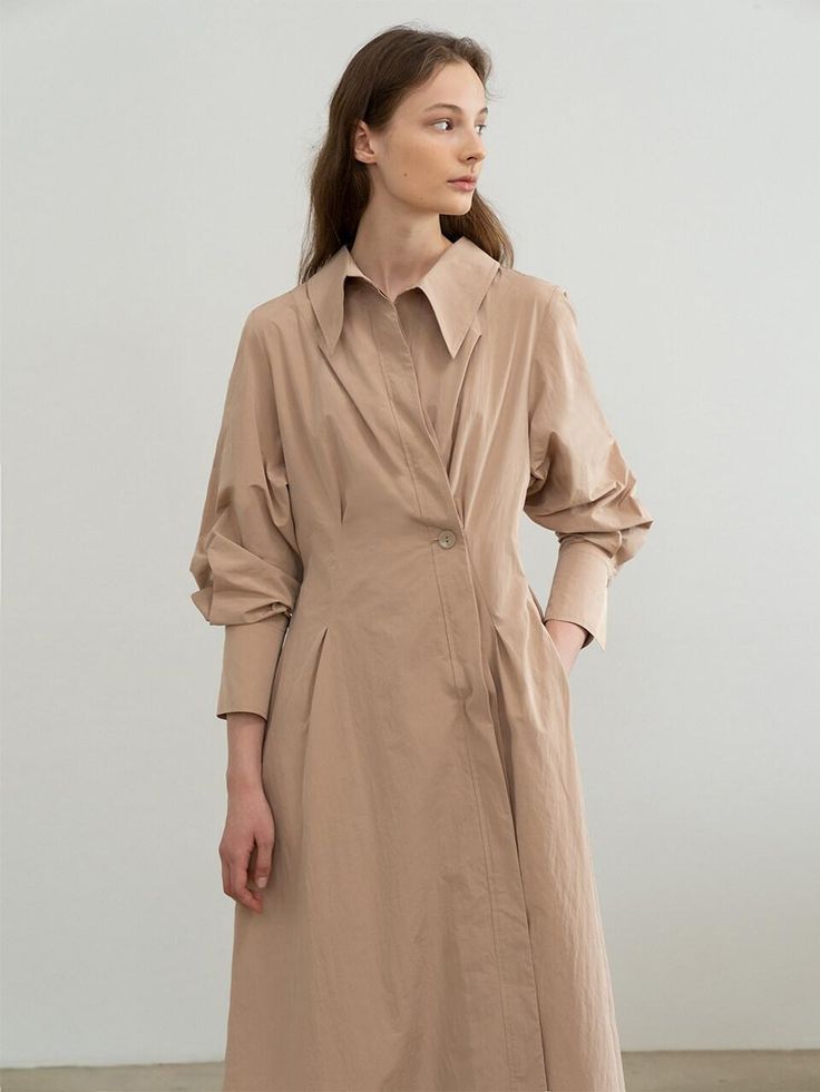 Editor's NotesRE RHEE's 'Chilling At 11:03AM" collection unveils thoughts about daily life and being myself. RE RHEE introduces refined luxury and moderate trends based on feminine and modern wears. - Midi dress- Unbalanced hem- Button closure- Volumed sleeve Measurements(in.)S/M/LShoulder: 15.3/15.7/16.1in.Chest: 33.2/35.2/37.7in.Sleeve: 23.2/23.4/23.6in.Length: 38.9/39.1/39.3in.*Model Height 5.7" Bust 31.1in. Waist 23.2in. Hips 35.4in. fitting S or S/M*Model Height 5.7" Bust 32.2in. Waist 23.2 Chic Relaxed Fit Shirt Dress For Work, Elegant Shirt Dress With Relaxed Fit For Spring, Elegant Relaxed Fit Shirt Dress For Fall, Elegant Beige Shirt Dress For Work, Elegant Relaxed Fit Midi Dress For Work, Chic Formal Shirt Dress With Relaxed Fit, Chic Beige Shirt Dress For Work, Elegant Beige Shirt Dress, Modern Long Sleeve Shirt Dress For Spring