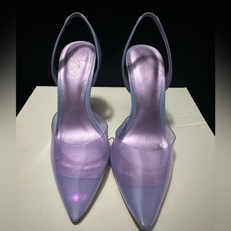 Purple And Blue Heels They Give Off A Holographic Appearance. The Front Is Clear With A Hint Of Purple. Heel Measures 5.5 In. New Never Worn!! Elegant Purple Synthetic Heels, Purple Synthetic Heels For Evening, Purple Synthetic Evening Heels, Lavender Heels For Spring Party, Fitted Purple Heels For Summer, Purple Synthetic Heels With 4-inch Heel, Purple 4-inch Heel Synthetic Heels, Lavender Heels With Pointed Toe For Party, Lavender Pointed Toe Heels For Party