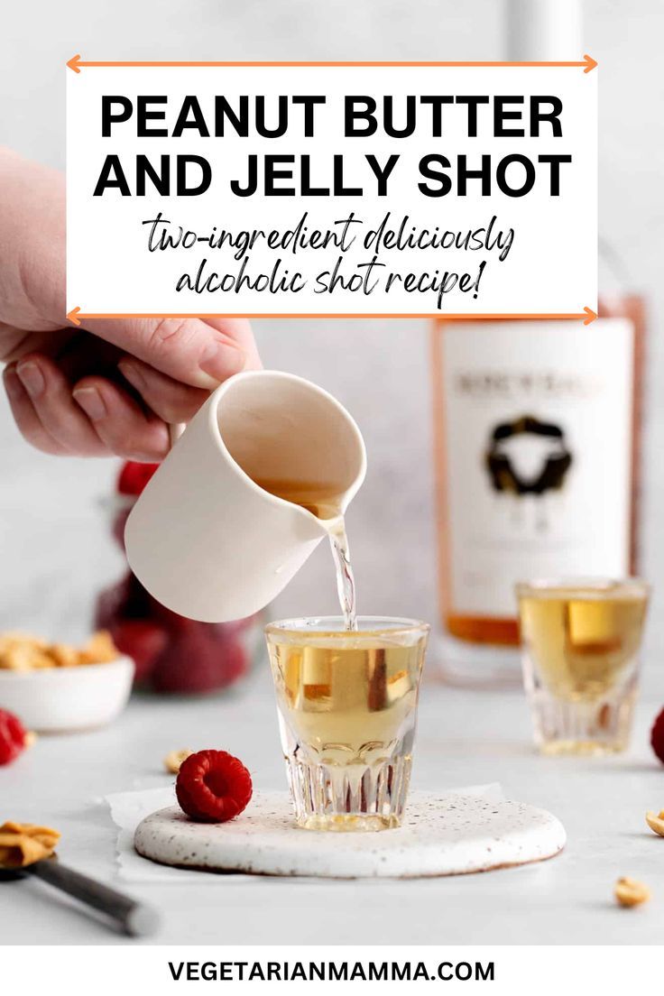 a person pouring tea into a glass with raspberries around it and the words, peanut butter and jelly shot