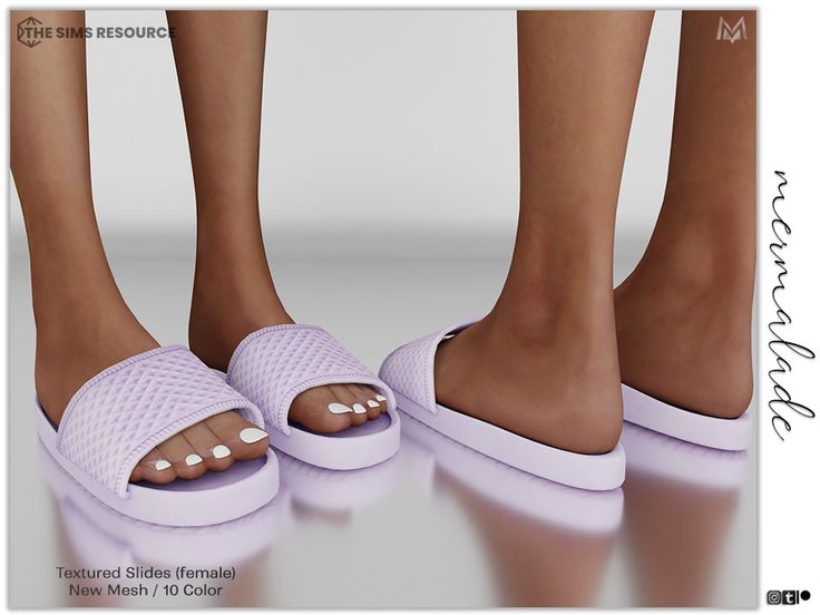 two women's feet wearing pink slippers with white dots on them