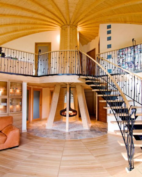 a spiral staircase in the middle of a living room