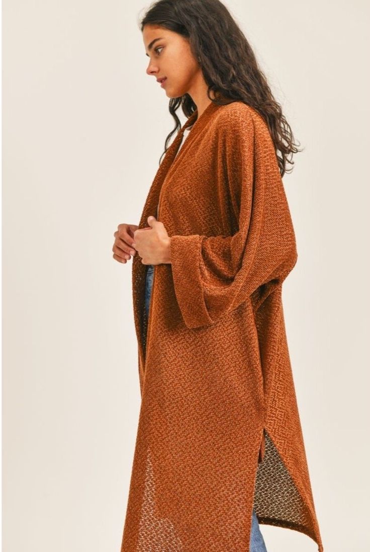 Model is 5'7" and wearing a size small. Made of 99% polyester and 1% spandex. Open Knit Cardigan For Fall Loungewear, Trendy Brown Sweater Coat For Layering, One Size Chic Cardigan For Fall, Brown Textured Knit Cardigan For Layering, Brown Open Front Sweater Coat For Layering, Trendy Brown Soft Knit Sweater Coat, Trendy Long Brown Cardigan, Cozy Brown Sweater Coat For Spring, Brown Cardigan For Spring Loungewear