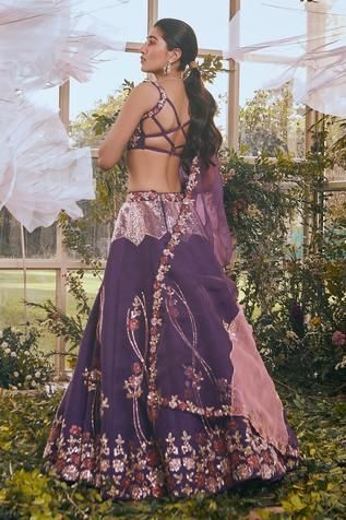 Dark purple lehenga with floral embroidered motifs. Paired with embroidered sleeveless blouse and sheer dupatta.
Component: 3
Pattern: Embroidered
Type Of Work: Floral
Neckline: Sweetheart
Sleeve Type: Sleeveless
Fabric: Raw Silk, Organza
Color: Purple
Other Details: 
Floral embroidery
Sheer dupatta
Embroidered blouse
Back criss cross
Occasion: Wedding - Aza Fashions Rachit Khanna, Lehenga Purple, Sheer Dupatta, Purple Lehenga, Latest Bridal Lehenga, Organza Lehenga, Lehenga Designs Simple, Embroidered Motifs, Neck Designs For Suits