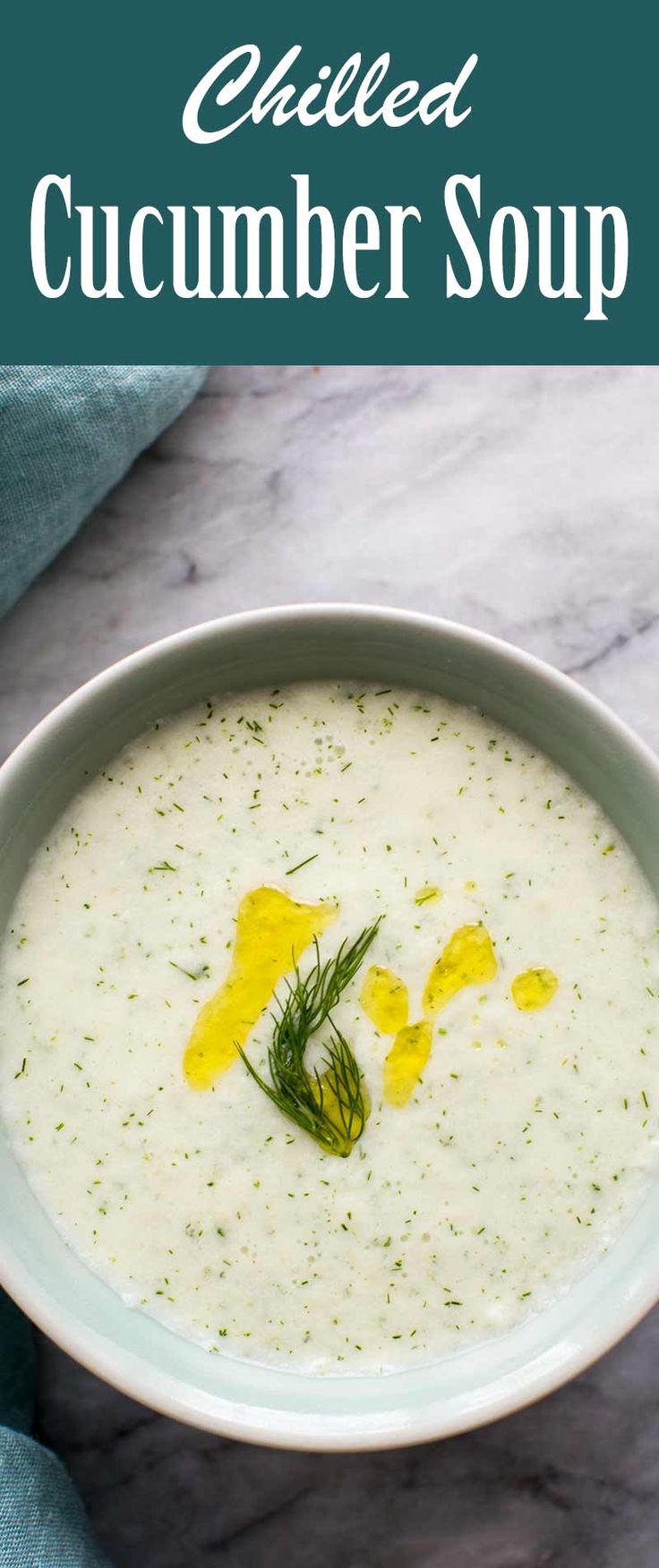 a white bowl filled with cucumber soup on top of a table