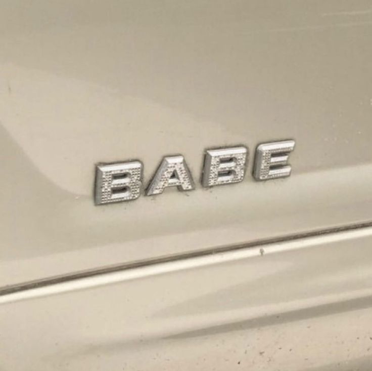 an old car with the word babe on it