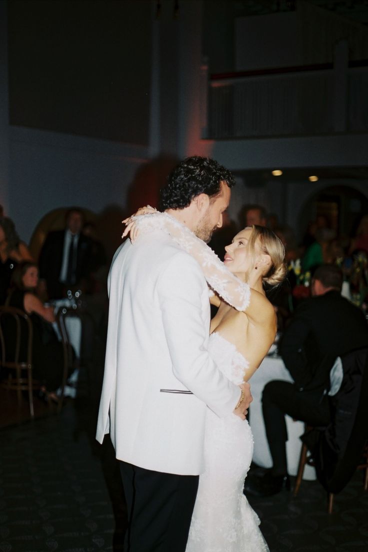 a bride and groom sharing their first dance