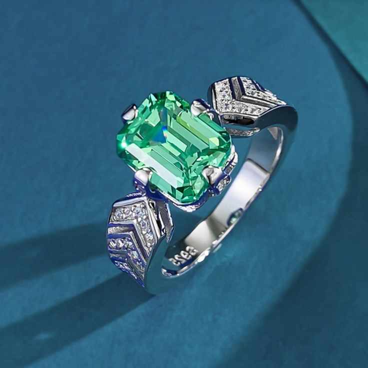 ✰ This stunning piece features a vibrant rectangular green tourmaline, known as the birthstone for October, perfectly set in a 925 sterling silver band.  ✰ The vivid green color of the tourmaline is beautifully highlighted by sparkling diamond-like accents, creating a captivating and luxurious look.  ✰ Sparkling diamonds add a touch of luxury and glamour to the design, making it perfect for any occasion.  ✰ Crafted from high-quality 925 sterling silver, this ring is both durable and hypoallergenic, ensuring long-lasting beauty and comfort.  ✰ Whether you're searching for the perfect gift for a friend, a loved one, or a special treat for yourself, this ring is sure to impress. Its sophisticated design makes it versatile enough for both everyday wear and special occasions, adding a pop of co Birthstone Band, Green Gemstone Ring, Green Tourmaline Ring, Baguette Ring, Diamond Jewelry Necklace, Cubic Zirconia Jewelry, Sparkling Diamond, Jewelry Christmas, Zircon Ring