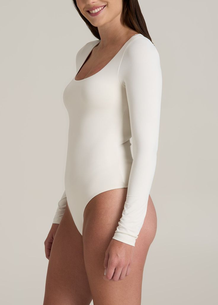 About Our Long Sleeve Square Neck Bodysuit for Tall Women This women’s tall bodysuit is the ultimate layering piece. Designed with a supremely comfortable stretch knit, it hugs the body to create a seamless silhouette that’s perfect for wearing under jeans, slacks, and skirts. We know for women with long torsos, bodysuits can be a challenge to find, that’s why we made this one just for women from 5’9 to 6’6. No more feeling cramped when you stand up or worrying about awkward necklines. We made t Scrubs Dress, Athleisure Summer, Cozy Sleepwear, Body Suits, Square Neck Bodysuit, Summer Lookbook, Long Torso, Sports Blazer, Long Sleeve Tee Shirts