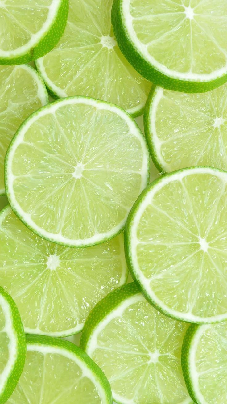 several limes are arranged in rows on top of each other