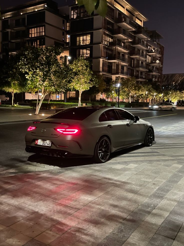 a car parked on the street at night