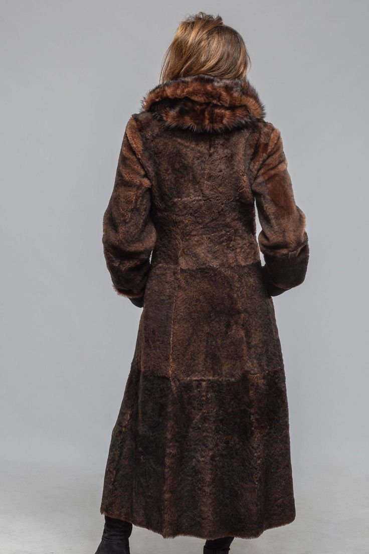 This shearling coat checks all the boxes; in addition to being delightfully soft and lightweight, it is incredibly warm; it features a luxurious soft shawl collar that is both elegant and necessary to protect you from the elements; and it is black AND brown which essentially means it goes with everything! 100% Italian shearling 2 buttons with additional collar button Foldable cuffs to accommodate any sleeve length Flattering slash side pockets that are positioned in the front and not on your hips! True to size. Model wears size 42, which comfortably fits over a heavy sweater, lightweight leather jacket, or blazer. (Height 5'8", Waist 28", Bust 34.5", Shoulder to Shoulder 16", usually wears size US 4/6) Made in Italy Soft Shawl, Travel Jacket, Heavy Sweaters, Check Coat, Mac Jeans, Knit Outerwear, Mens Vests, Selvedge Denim, Sport Dress