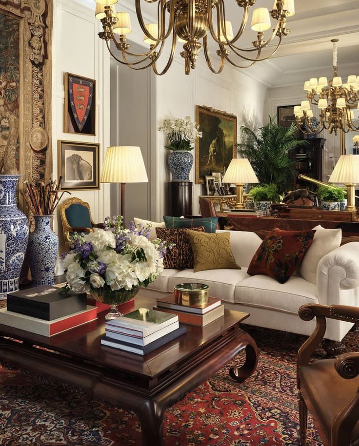 a living room filled with lots of furniture and decor on top of a wooden table