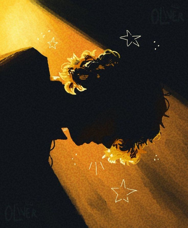 a person with their head down in the dark and stars on the floor behind them