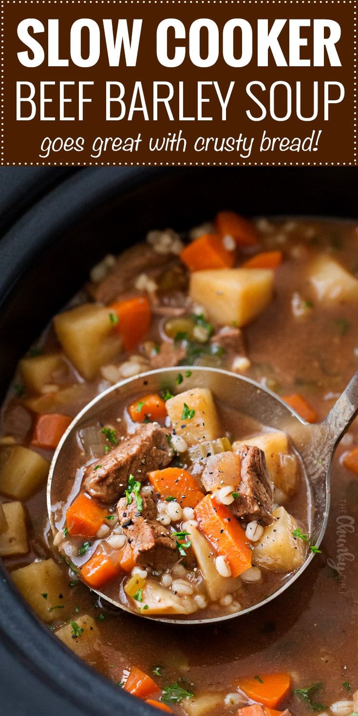 slow cooker beef barley soup in a crock pot with a ladle full of stew