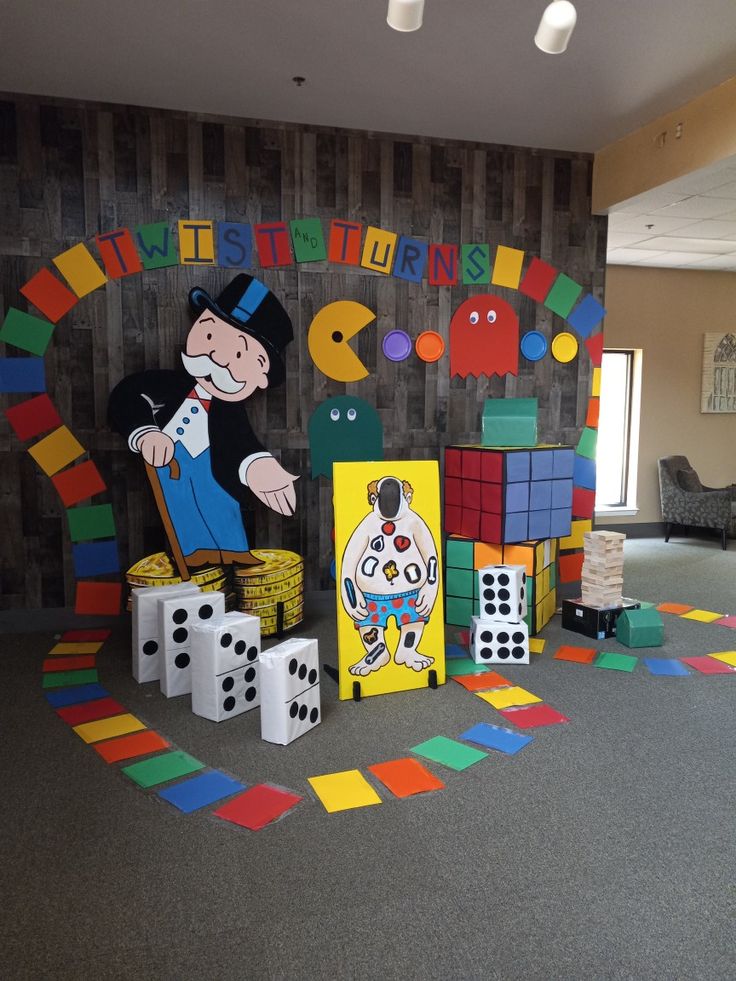 the room is decorated with lots of colorful blocks and dices for children to play