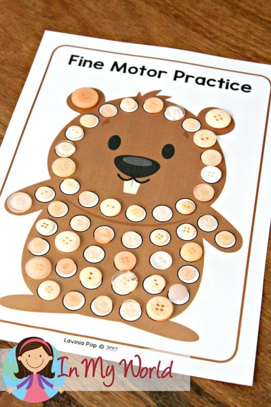 a bear made out of buttons sitting on top of a wooden table with the words fine motor practice