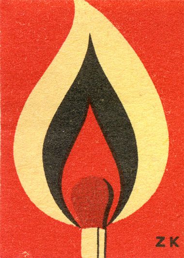 a red and black match card with a lit match