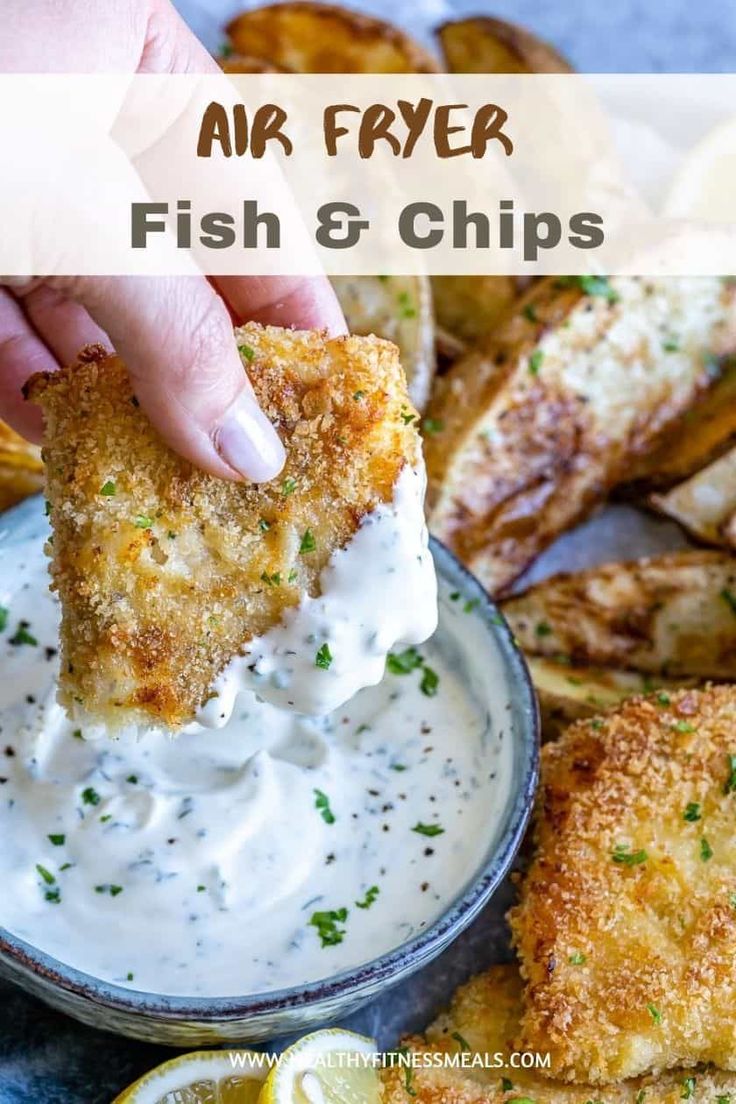 air fryer fish and chips in a small bowl with sour cream sauce on the side