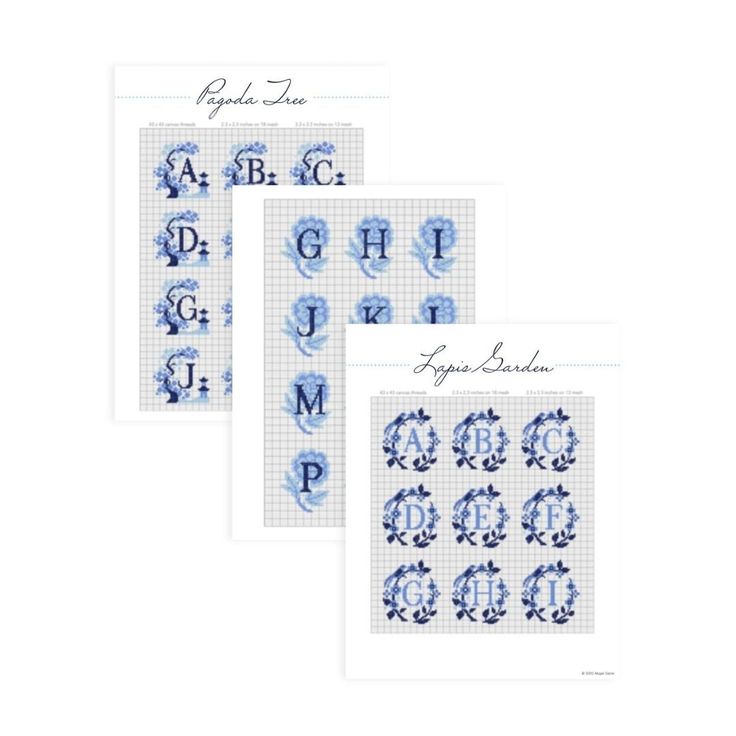 three cross stitch alphabets in blue and white