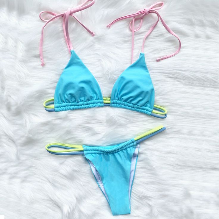 This bold bikini set that comprise colorful strings is in trend. The stringy two piece swimsuit features a sliding triangle swim top with removable soft padding cups for comfort, a double-string design under the bust, adjustable slender shoulder straps for a flattering fit, an s-hook closure to the rear, contrasted pipings and solid color blocks allover, and the matching string bikini bottom has contrasting elastic strings at the sides, a cheeky back coverage for a lengthening effect. Size (in)BustWaistHipS26-2825-2828-30M28-3128-3030-31L31-3330-3231-33 Sunbathing Swimwear With Drawstring And String Shape, String Swimwear With Drawstring, Poolside String Swimwear With Drawstring, String Swimwear With Drawstring For Poolside, Pool Swimwear With Tie-side Bottom And Straps, Tie-side Bottom Swimwear With Straps For Pool, Multicolor String Swimwear For Poolside, Nylon Triangle Top Swimwear With Drawstring, Adjustable String Swimwear For Pool