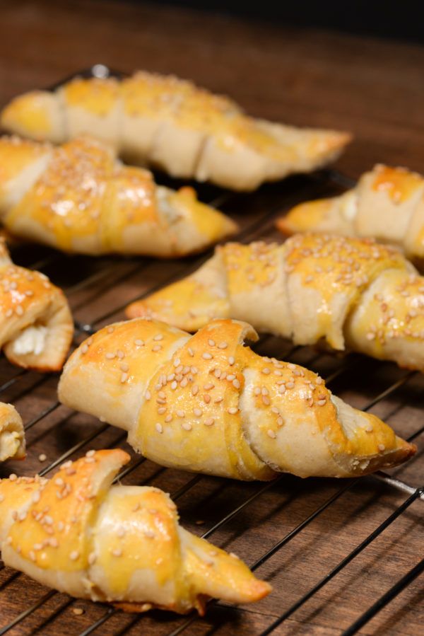 several pastries are cooling on a wire rack