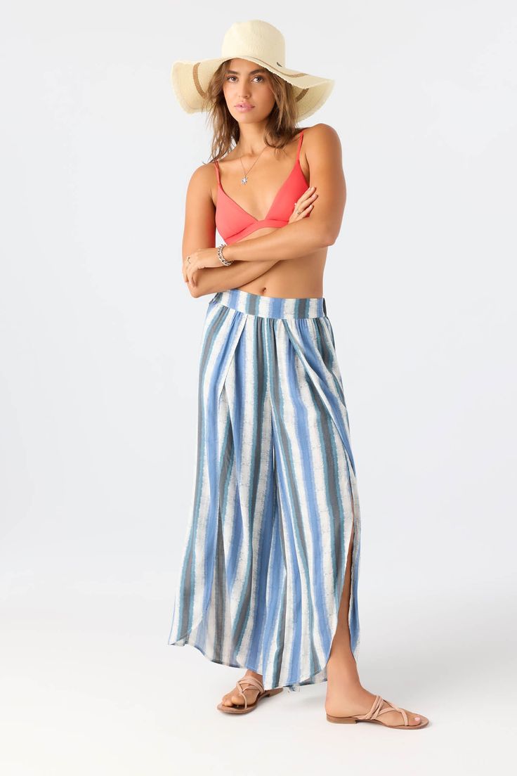 Laid-back, flowy woven pant that radiates effortless style. It features an elastic waist, wider fit and split leg detail. O'Neill Women's woven pant 28" Inseam 12.5" Front rise Elastic waist Wide leg fit Split leg detail 100% Viscose | O'Neill Women's Tymea Faded Stripe Fly Away Beach Pants in Slate, Size XL, Viscose Blue Bottoms For Beach Cover-up In Beach Season, Relaxed Fit Ankle-length Beach Pants, Casual High-waisted Harem Pants For Beach, Beach Season Straight Pants, Casual Ankle-length Wide Leg Beach Pants, Casual Wide Leg Ankle-length Pants For Beach, Straight Pants With Elastic Waistband For Beach Season, Elastic Waistband Bottoms For Beach In Spring, Blue Ankle-length Beach Pants