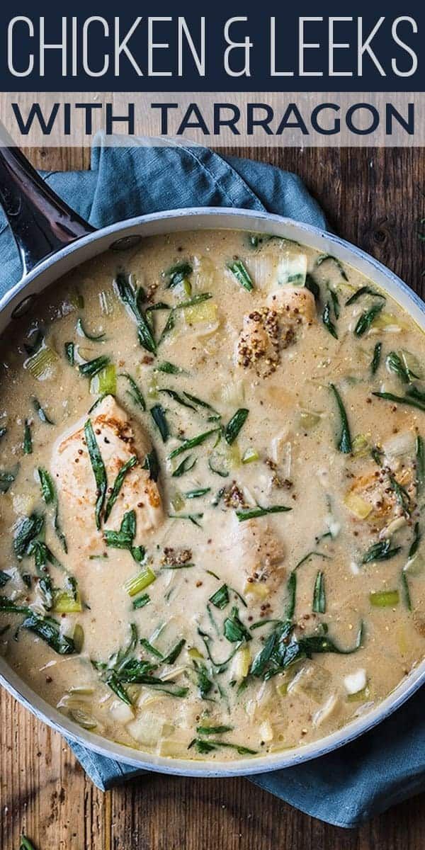 chicken and leeks with tarragon in a skillet on a wooden table