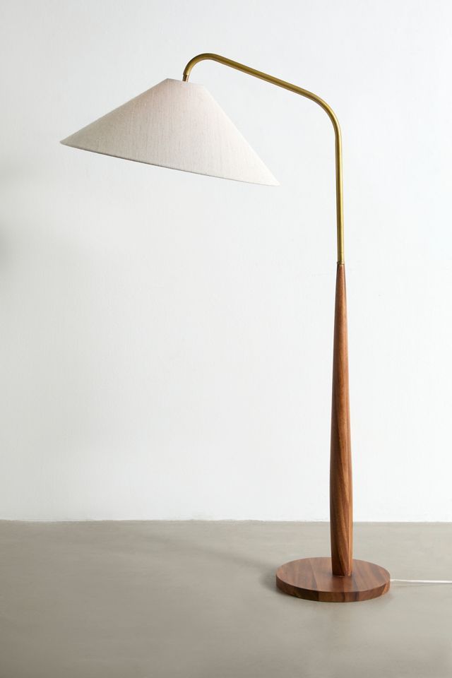 a wooden table lamp with a white shade on it's base and a gold metal arm