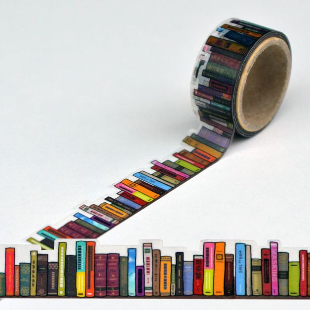 a roll of tape with colorful books on it next to a row of bookshelves