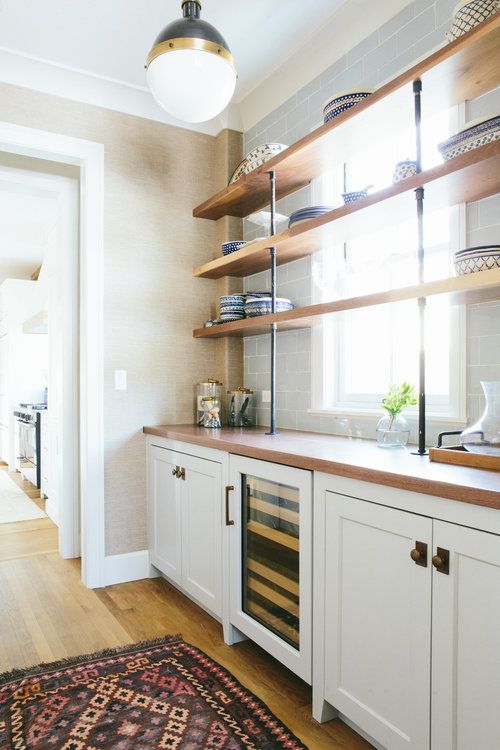 the kitchen is clean and ready to be used for wine tasting or cooking, with plenty of storage space