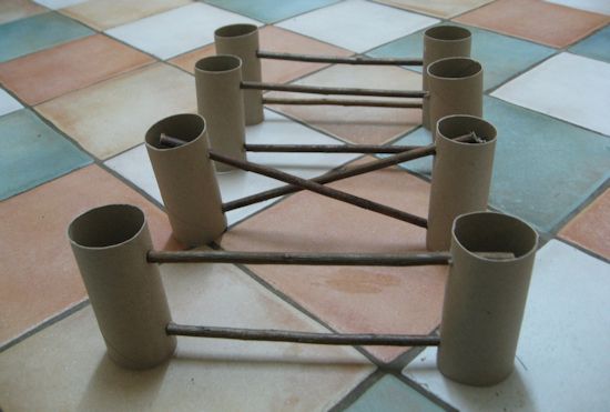 several rolls of toilet paper sitting on top of a tiled floor