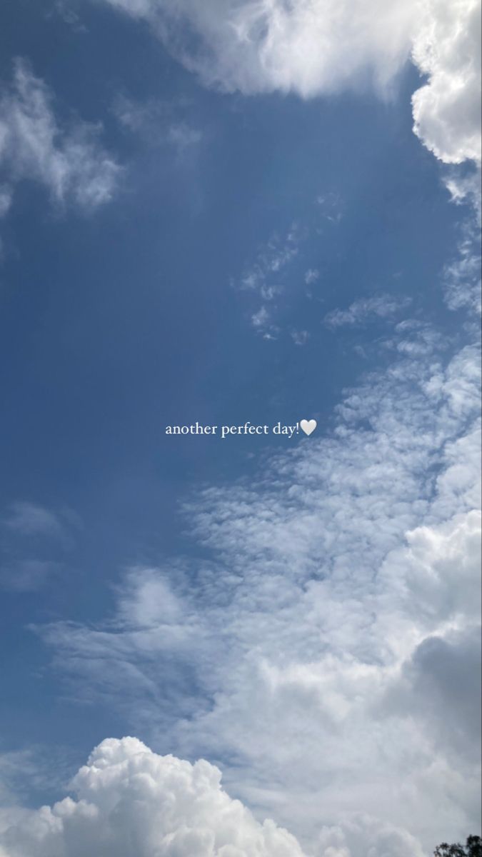 the sky is filled with white clouds and there is a heart shaped word in the middle