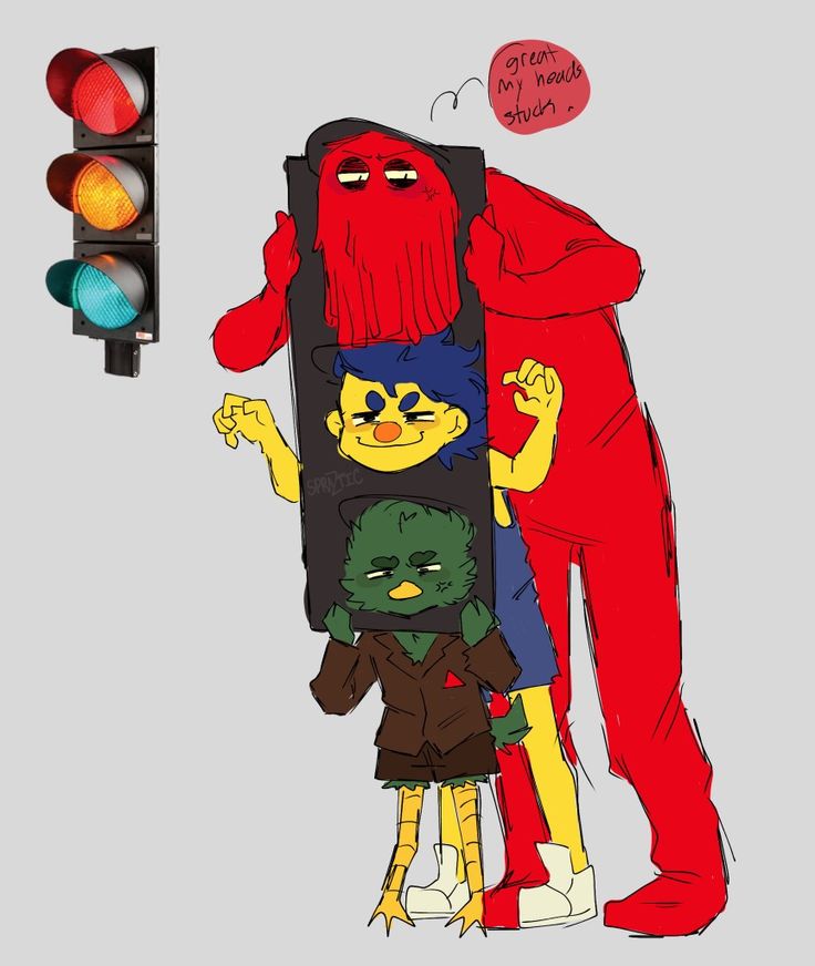 two people standing next to each other in front of a traffic light with one person wearing a red costume